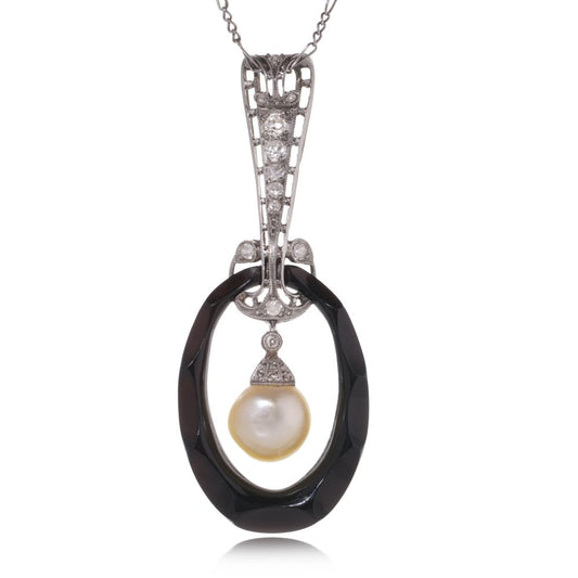 Antique platinum pendant necklace with pearl, onyx, and diamonds.