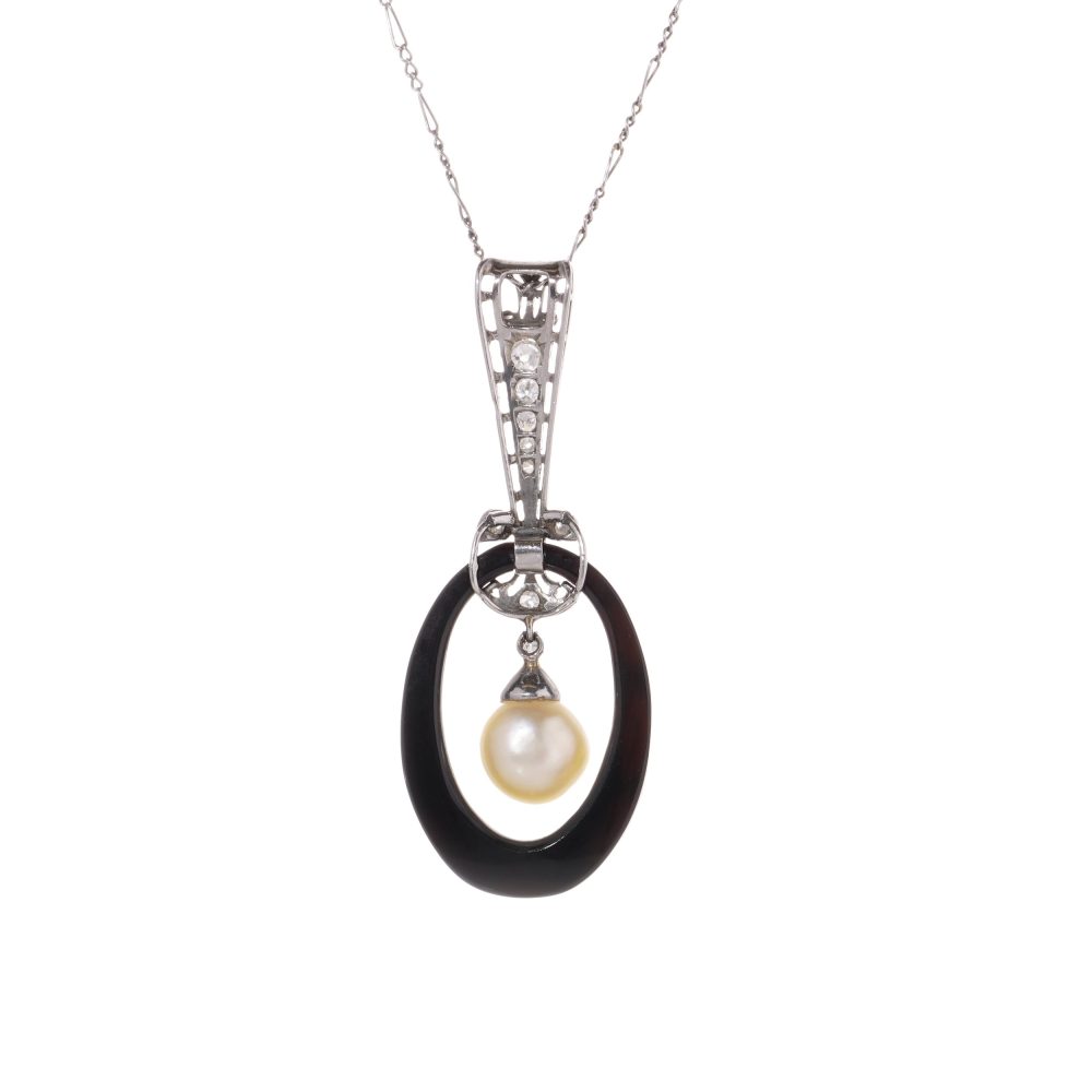 Antique platinum pendant necklace with pearl, onyx, and diamonds.