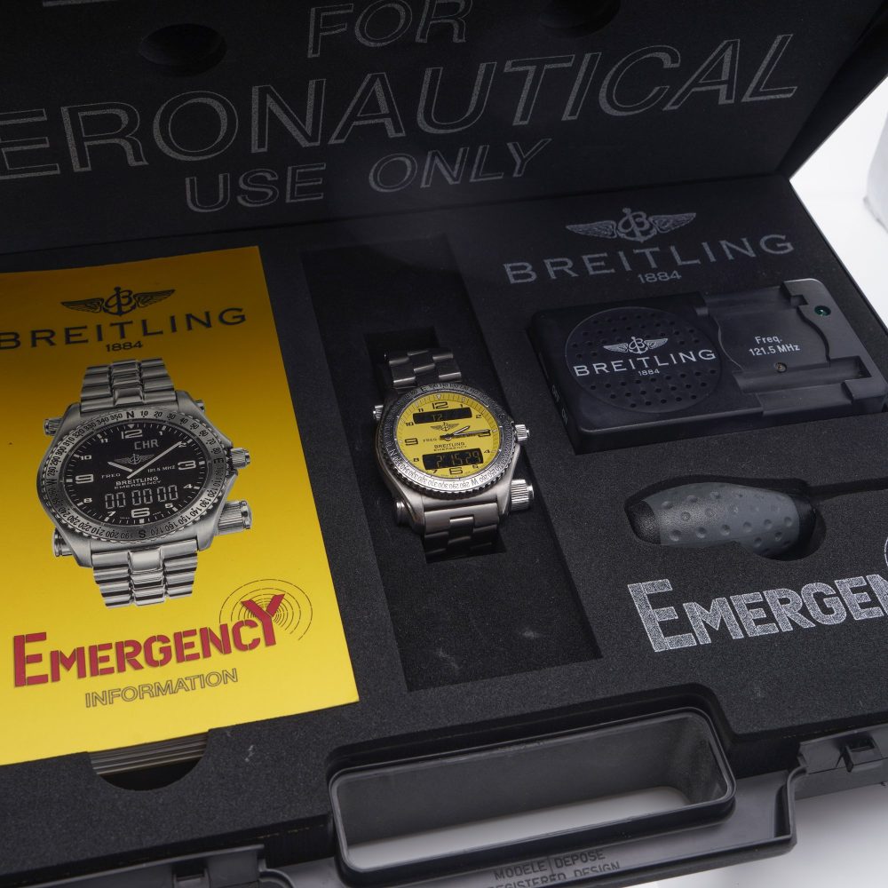 Breitling Emergency 43mm Titanium Quartz Watch Full Set with Box and Papers and service history from 1998. Titanium Case Yellow Dial Emergency Transmitter Original Breitling Briefcase marked "For Aeronautical Use Only." All Original Manuals and Documentation Emergency Information booklet Warranty User Manual