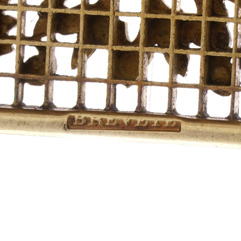 Lingerie pin brooch in gold with enamel and diamonds.