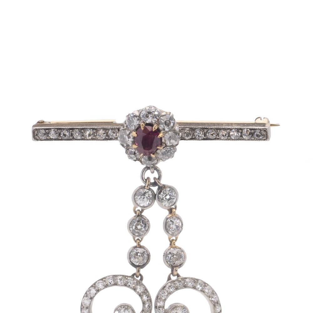 Antique gold bar brooch and pendant set with ruby and diamonds. Circa 1900's.