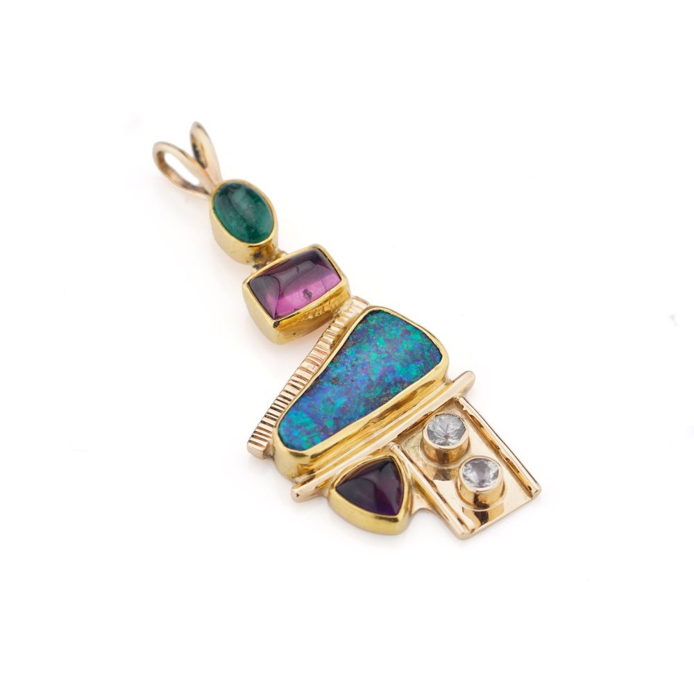 Gold pendant with opal, diamonds, emerald, amethyst, and pink spinel.