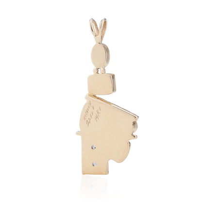 Gold pendant with opal, diamonds, emerald, amethyst, and pink spinel.