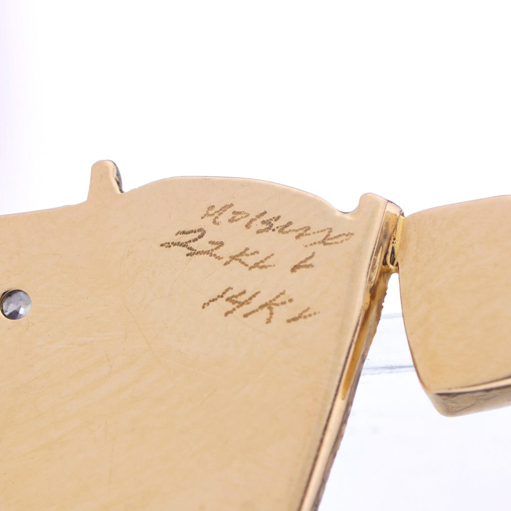 Gold pendant with opal, diamonds, emerald, amethyst, and pink spinel.