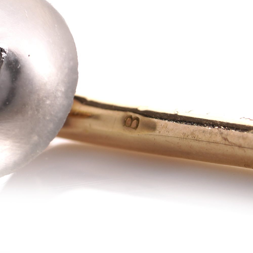 Cartier cufflinks and shirt studs in gold and platinum with rock crystals and diamonds.