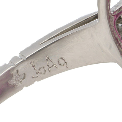 Platinum oval ruby cluster ring surrounded by rubies diamonds.