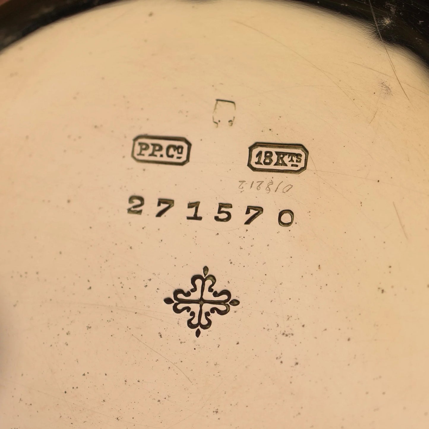 Close-up of a yellow gold watch case back stamped PP.Co 18KTS 271570