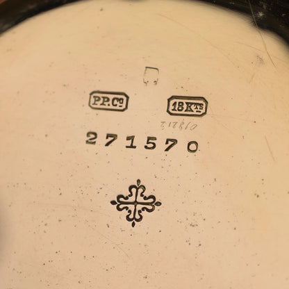 Close-up of a yellow gold watch case back stamped PP.Co 18KTS 271570