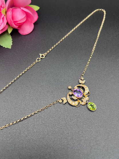 A yellow gold peridot, amethyst and seed pearl pendant necklace