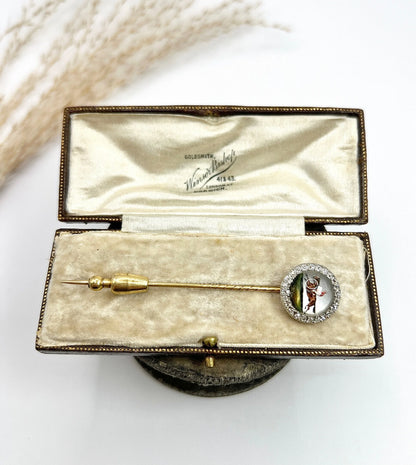 An antique Essex glass and diamond stick pin depicting a jockey riding a horse, in a box