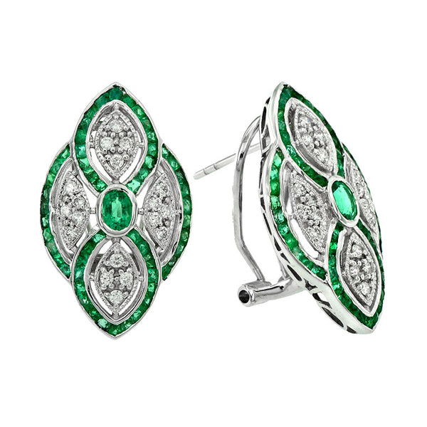 Art Deco Style Emerald and Diamond Cluster Clip Earrings; central 0.60ct oval emeralds within a fluid navette shaped 0.36ct diamond surround detailed with a 3.24ct calibre emerald outer border, in 18ct white gold with post and clip fittings