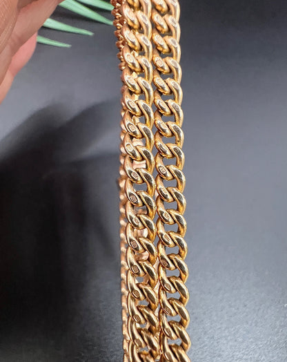 Close-up of gold curb links