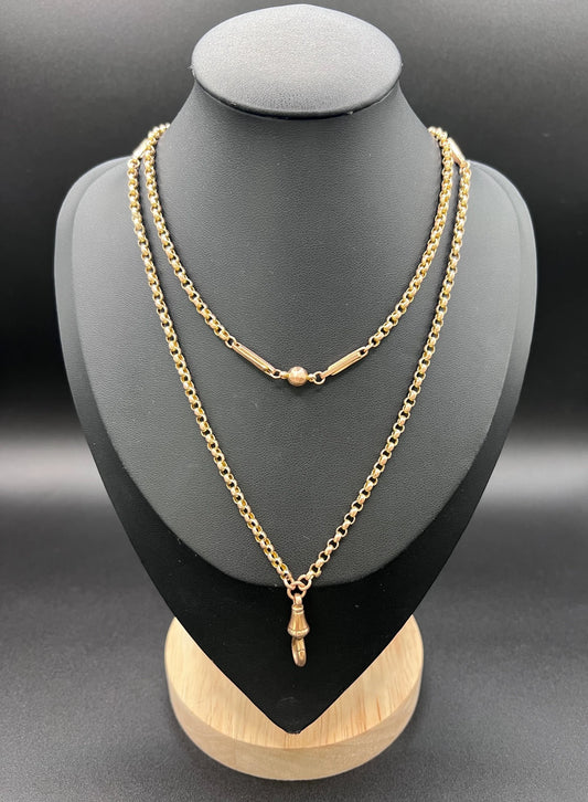 A long rose gold chain necklace with a dog clip clasp