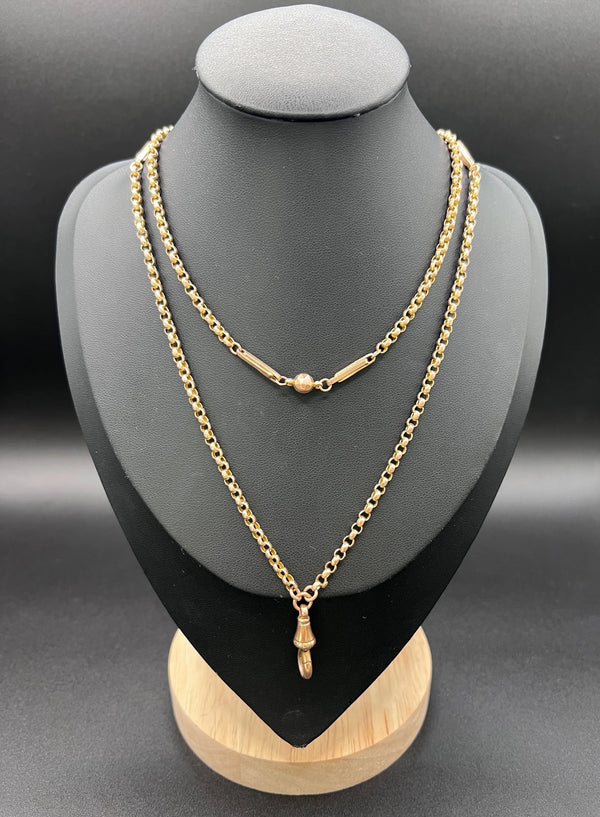 A long rose gold chain necklace with a dog clip clasp