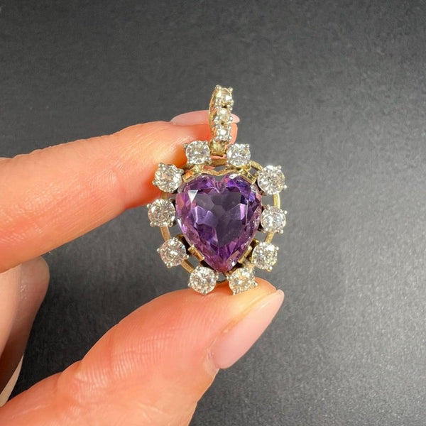 Antique Art Deco Heart Amethyst and Diamond Cluster Pendant, heart-shaped amethyst surrounded by halo of diamonds with diamond bail in 14ct yellow gold. Circa 1920s