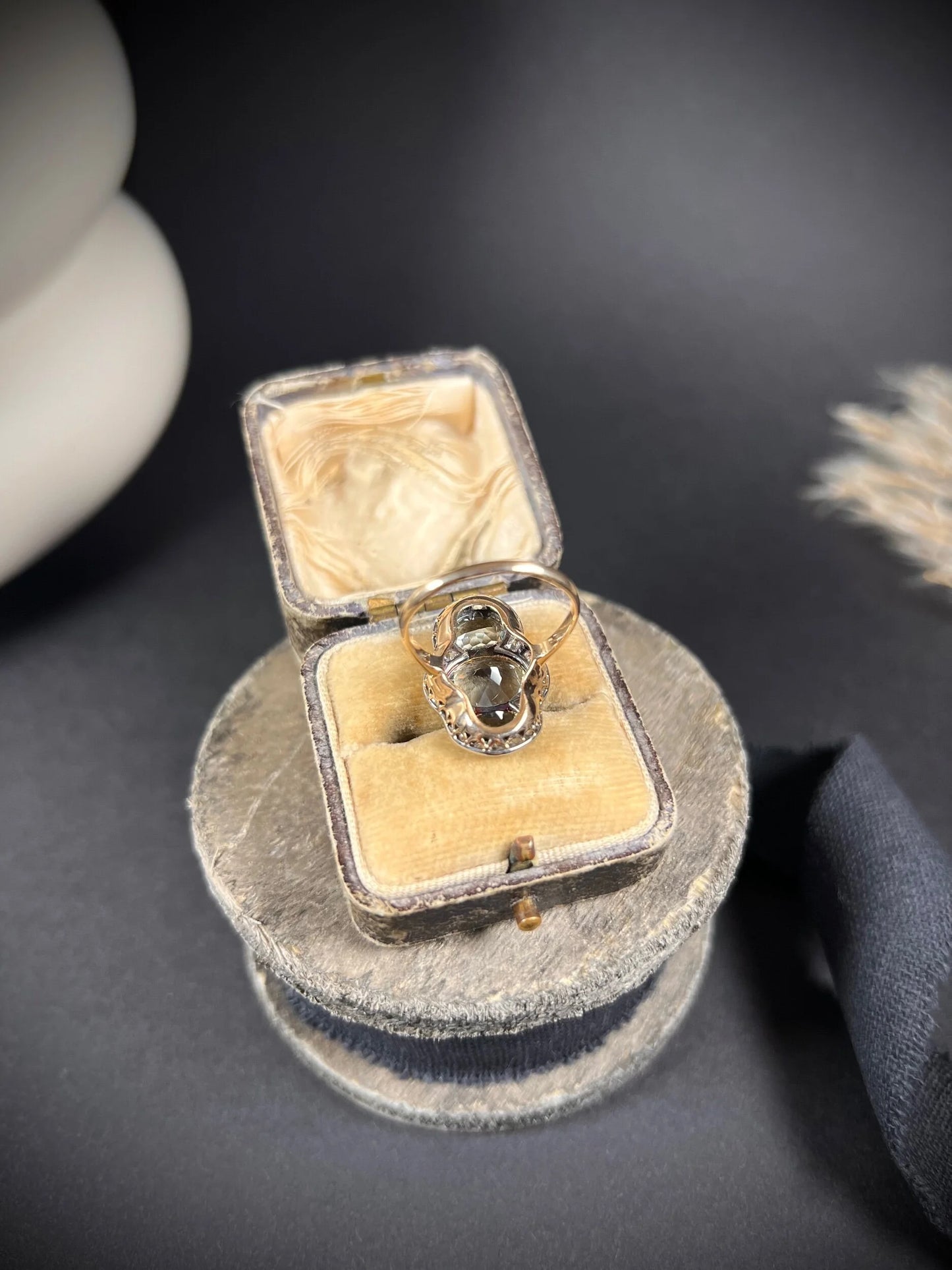 An aquamarine and diamond cocktail cluster ring, in an antique ring box