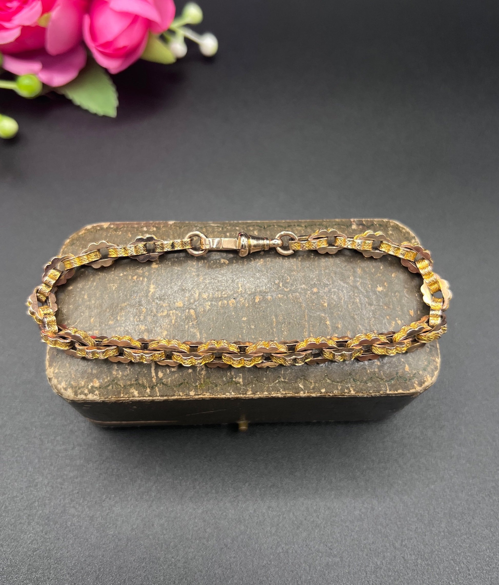 A fancy link yellow gold bracelet with a lobster claw clasp