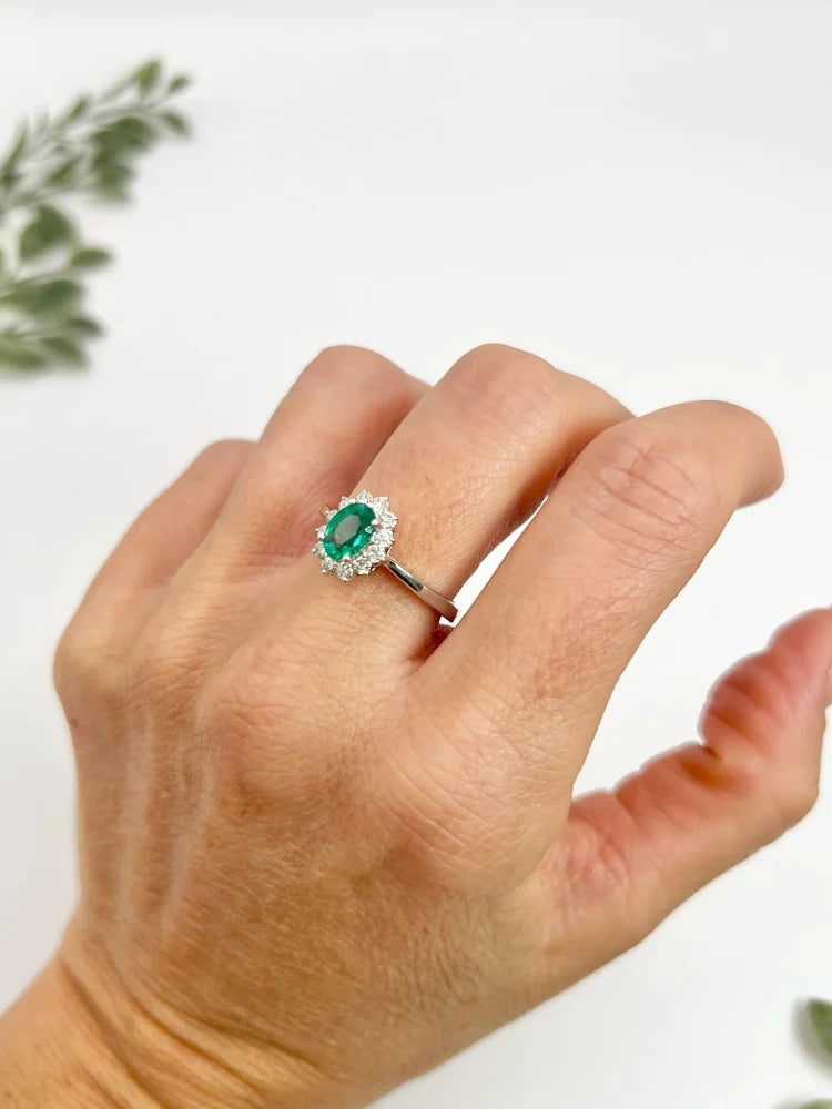 Emerald And Diamond Cluster Ring In 18 Carat White Gold