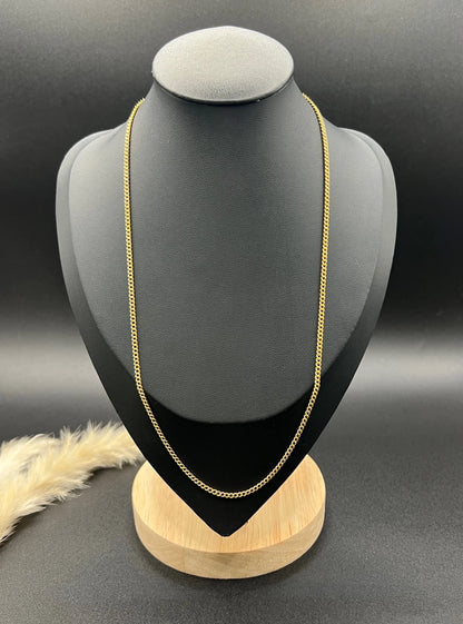 A fine curb link chain necklace in yellow gold