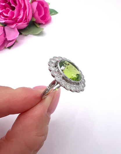 Antique French Platinum Peridot and Diamond Halo Cluster Ring, Circa 1910