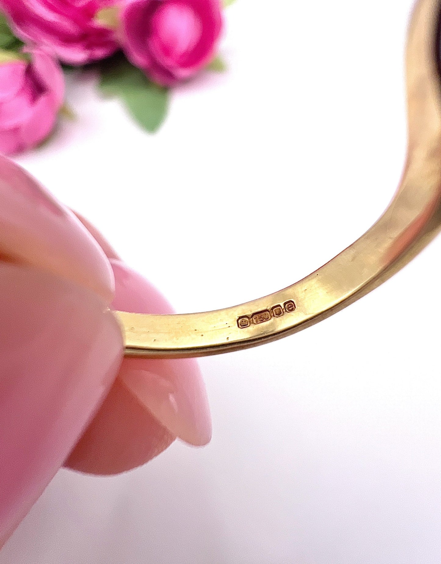 Hallmark inside a yellow gold ring shank