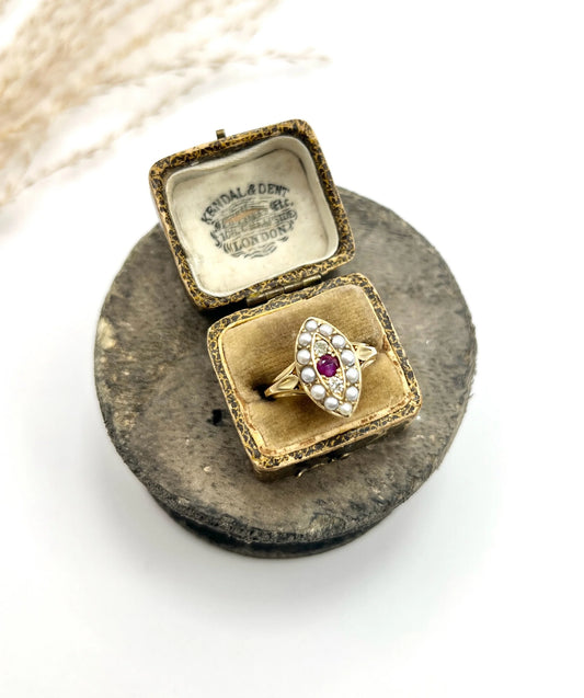 A navette shaped pearl, diamond and ruby cluster ring in yellow gold, in a box