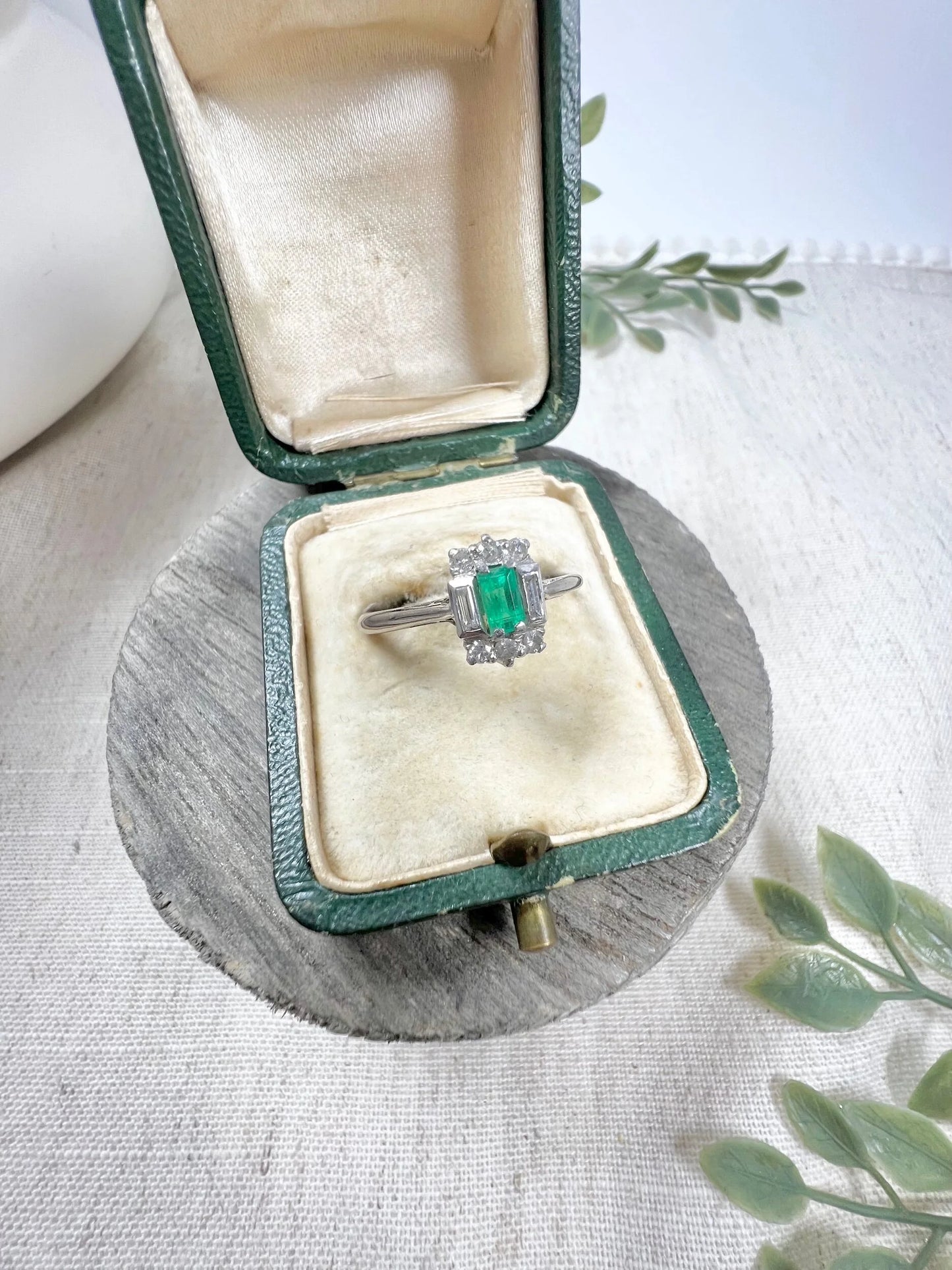 Vintage 18 Carat White Gold Emerald Cut Emerald and Diamond Cluster Ring, Circa 1940