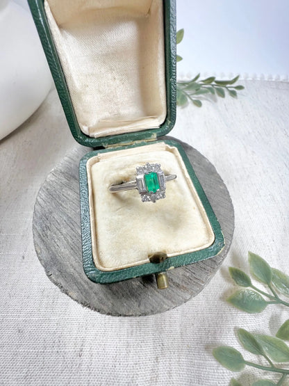 Vintage 18 Carat White Gold Emerald Cut Emerald and Diamond Cluster Ring, Circa 1940