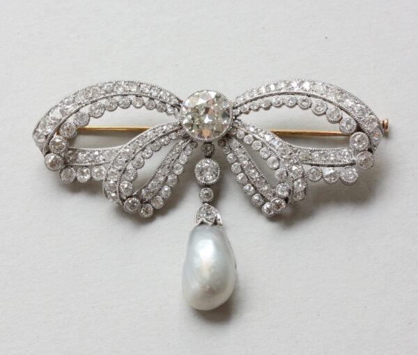 Antique Edwardian 6ct Old Cut Diamond and Pearl Garland Bow Brooch; large platinum garland bow brooch set with old-cut diamonds and baroque pearl, c.1910