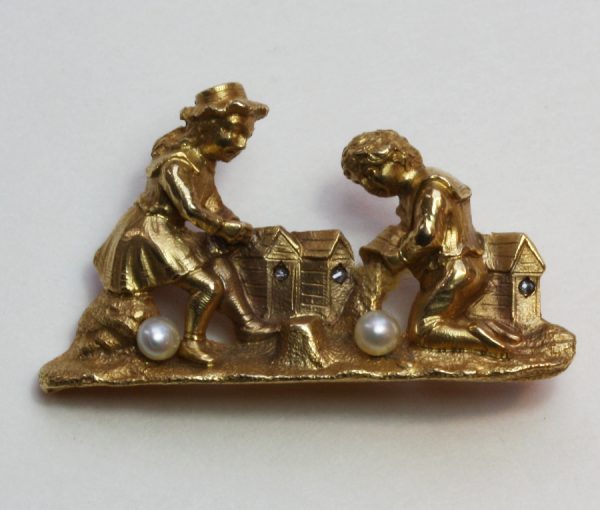 Antique Edwardian Gold and Pearl Sandcastle Brooch; gold brooch representing two children making sandcastles on the beach, with pearl accents. France, Circa 1910