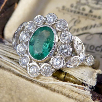 Edwardian Style Emerald and Diamond Oval Cluster Platinum Ring