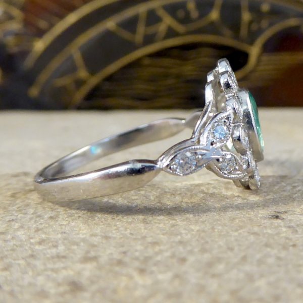 Edwardian Style Emerald and Diamond Oval Cluster Platinum Ring