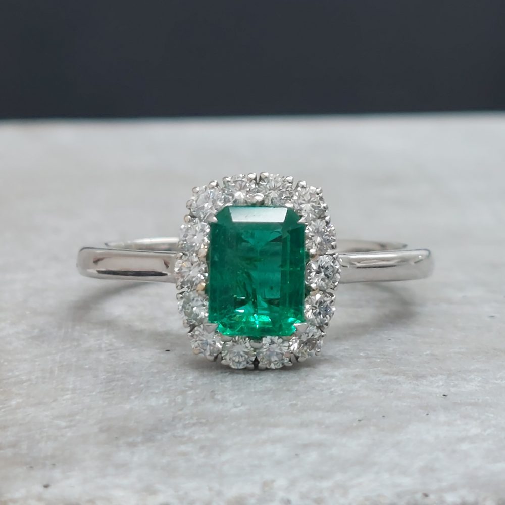 Emerald Cut Emerald and Diamond Cluster Ring in 18ct Gold, 1.13 carats