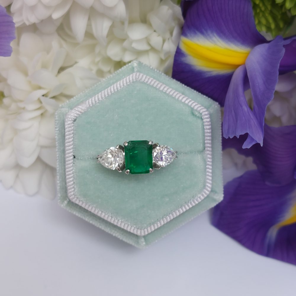 Emerald and Pear Shaped Diamond Three Stone Ring