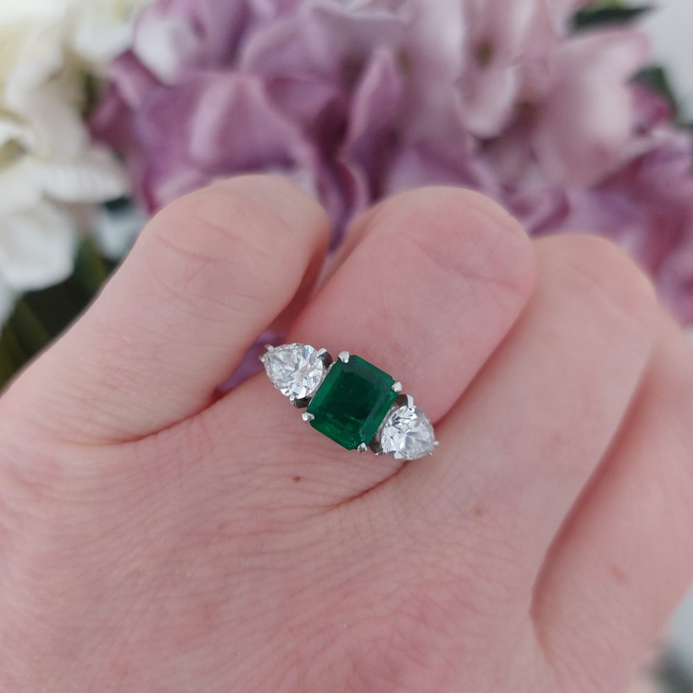 Emerald and Pear Shaped Diamond Three Stone Ring