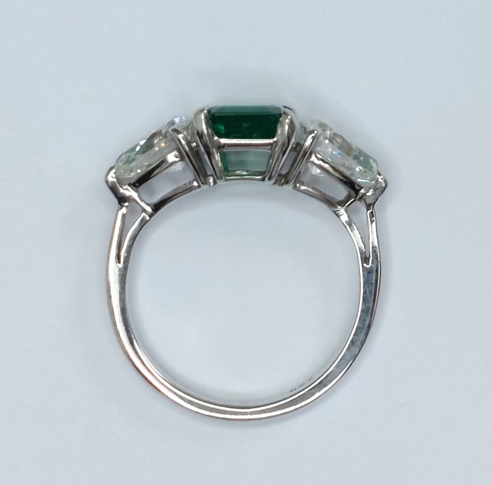 Emerald and Pear Shaped Diamond Three Stone Ring