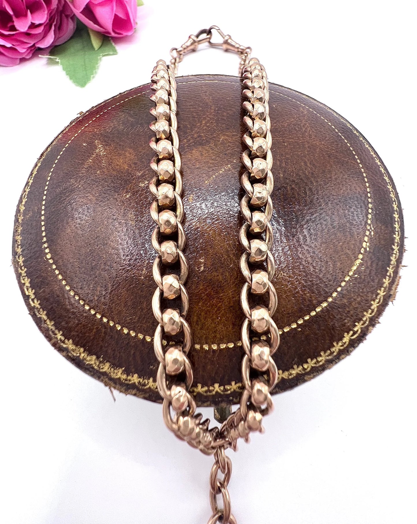 A rose gold fancy link Albert chain necklace with a T-bar attachment