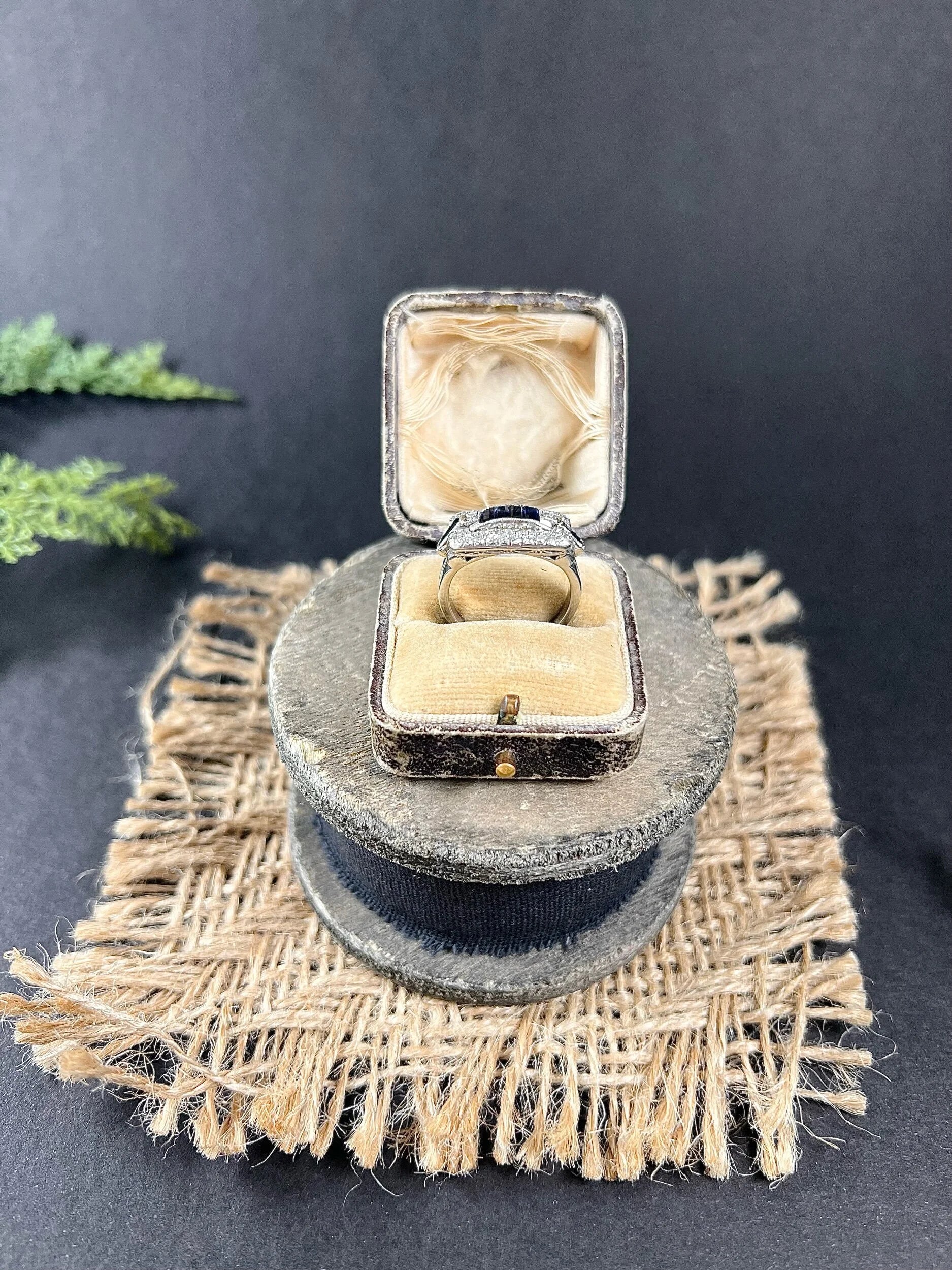 A sapphire and diamond cocktail ring in platinum, in an antique ring box