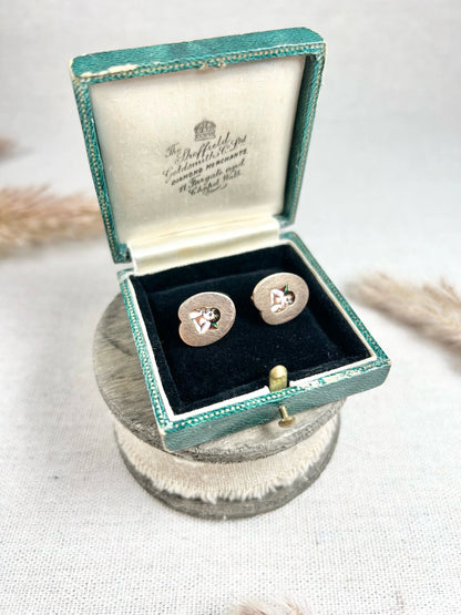 A pair of art palette shaped gold earrings with enamelled cherubs, in a box