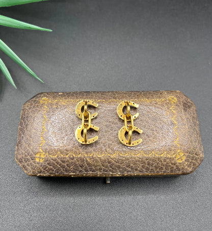 A pair of double-sided horseshoe cufflinks in yellow gold