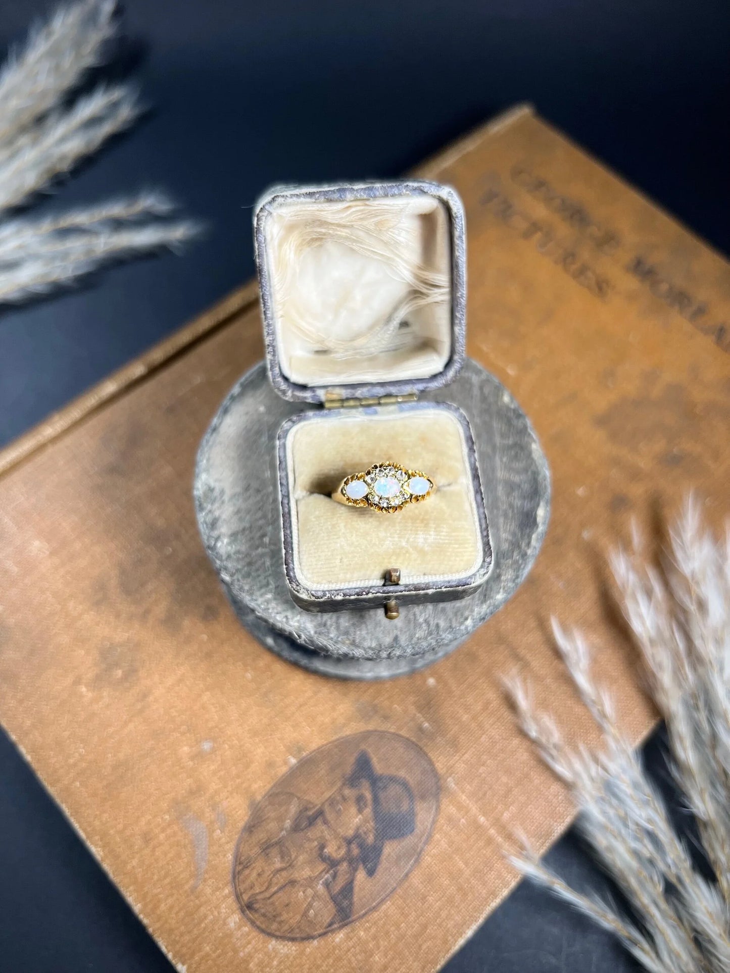 A yellow gold opal and diamond dress ring, in a ring box