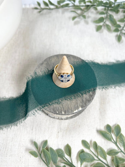 Edwardian 18 Carat Gold, Platinum, Sapphire and Diamond Daisy Cluster Ring, Circa 1910