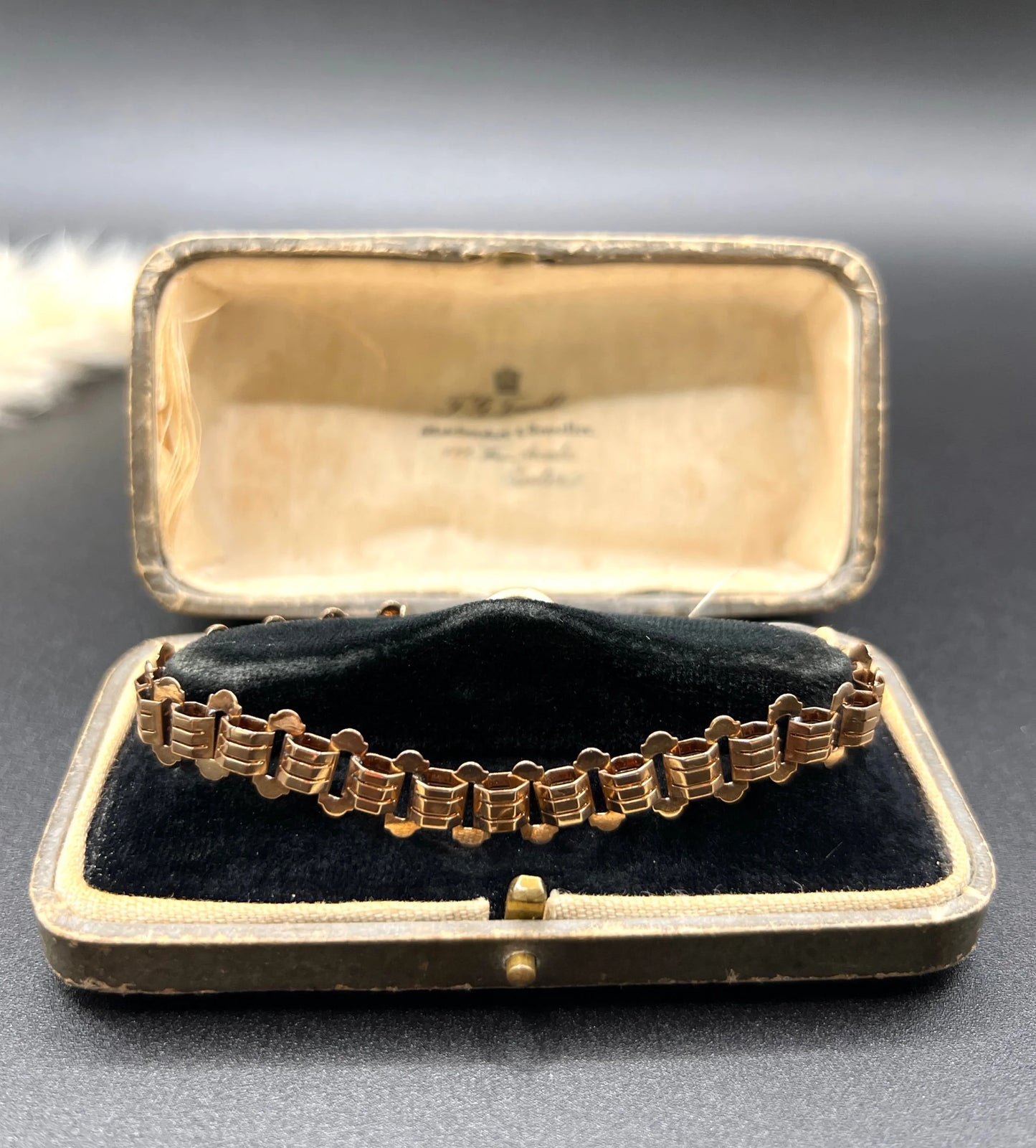 A rose gold fancy link bracelet, in an antique bracelet box