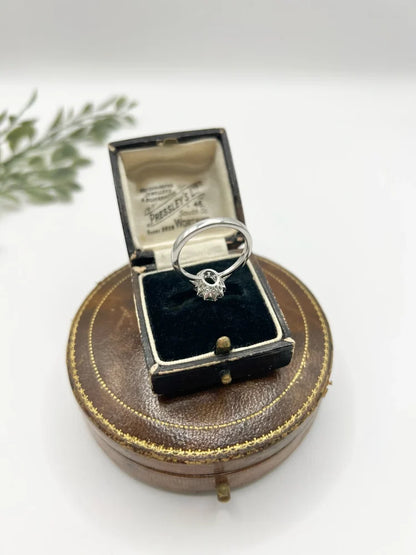 Emerald And Diamond Cluster Ring In 18 Carat White Gold