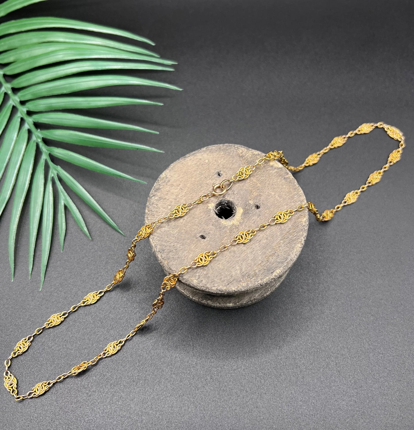 A yellow gold fancy link chain necklace