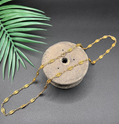 A yellow gold fancy link chain necklace