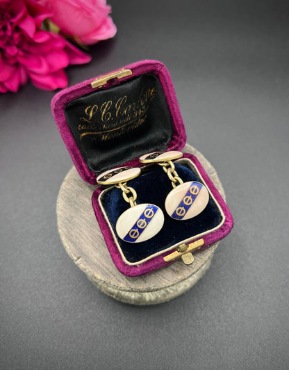 A pair of yellow gold enamel striped cufflinks with chain link fittings, in an antique box