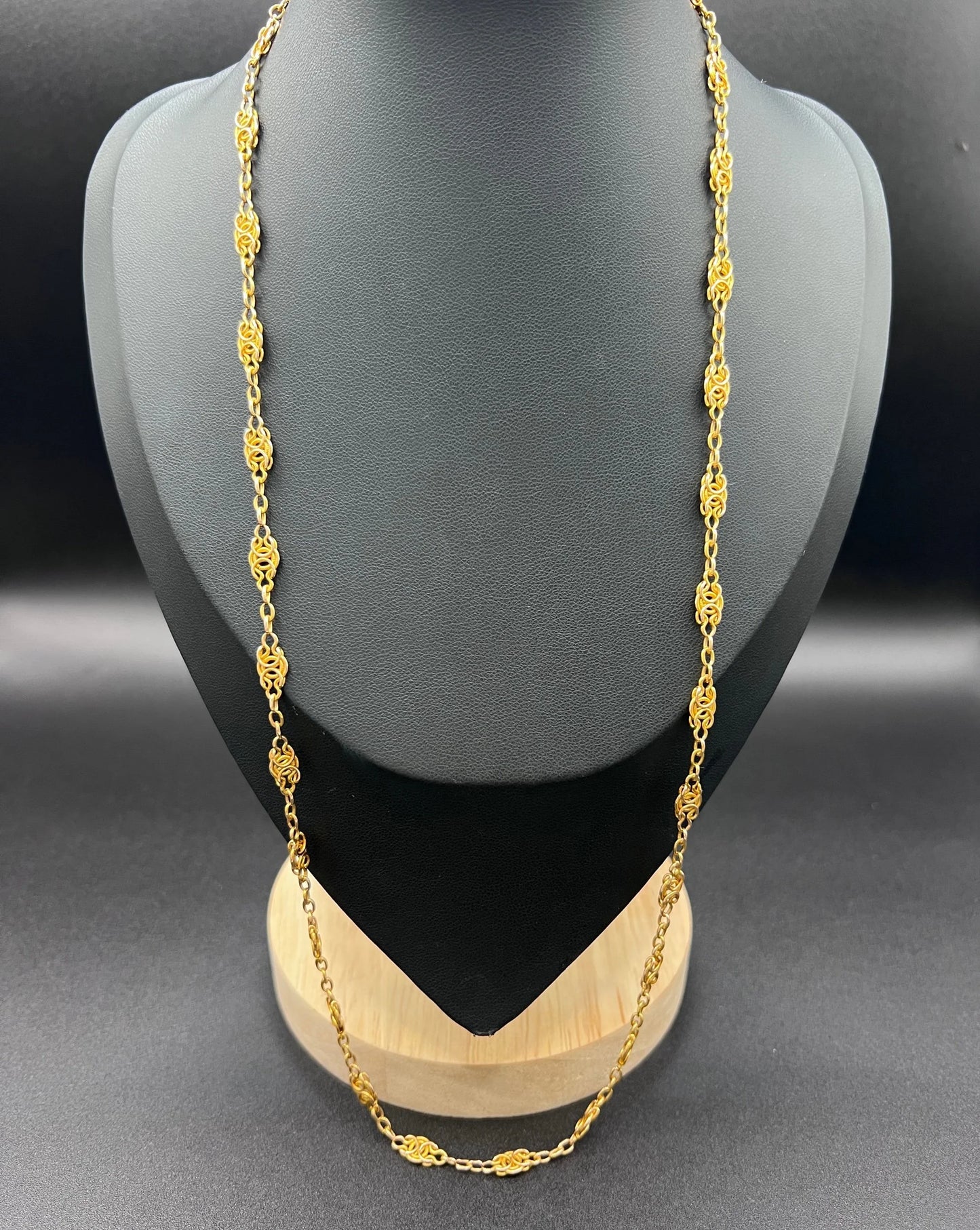 A yellow gold fancy link chain necklace