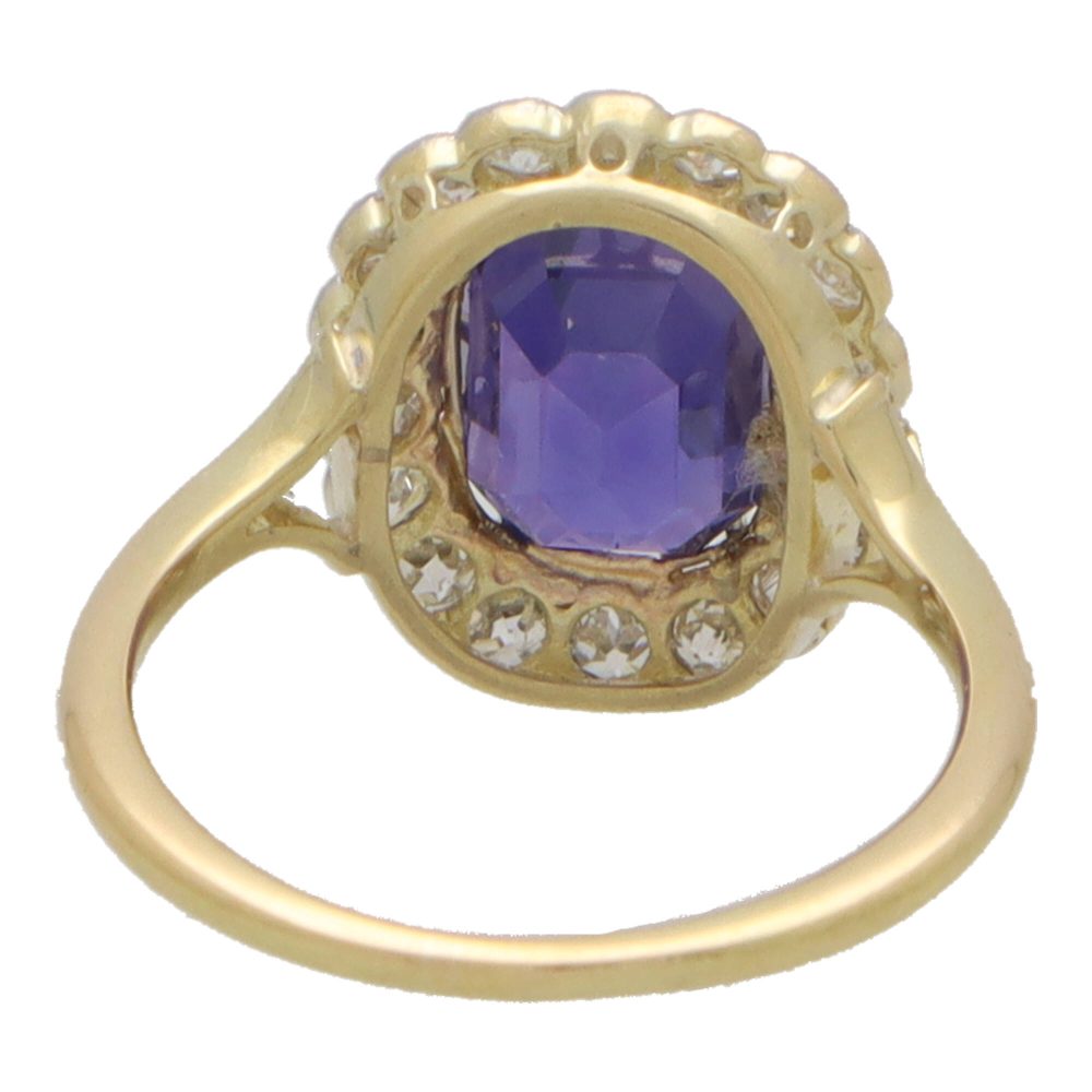 Vintage colour change sapphire and diamond cluster ring in yellow and white gold.