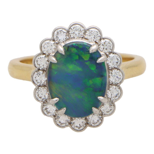 Black opal and diamond cluster ring in gold and platinum.